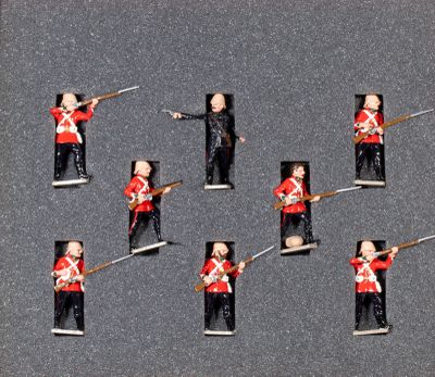 six toy soldiers that are standing in a row