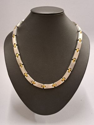 PEQUINET Collier "Moorea" en acier et métal doré.