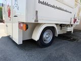 a white truck that is parked on the side of the road