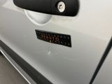 a close up of a car door handle with a sticker on it
