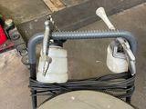 a machine that is sitting on the ground in the garage