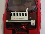 a red toy car with a keyboard on top of it