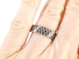 an image of a woman ' s hand with a diamond ring on it