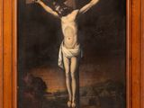 a painting of jesus on the cross with a wooden frame