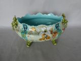 a blue bowl with a floral design on it