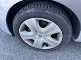 a close up of a car ' s tire on the road