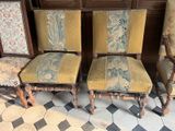 three chairs with a yellow upholstered seat and a black and white checkered floor