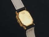 an image of a close up of a watch on a black surface