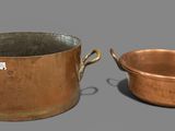two pots that are sitting next to each other on a table