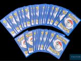 a lot of pokemon cards on a black background