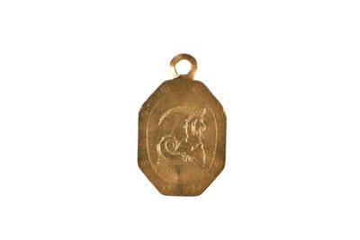 a close up of a gold medal with a horse on it