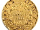 a close up of a gold coin with a wreath on it