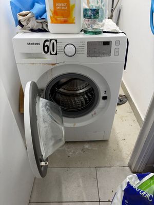an image of a washing machine in a small room