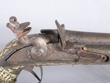 an old gun with a wooden handle on a white background