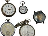four different types of pocket watches on display