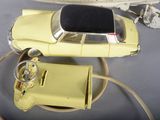 a yellow toy car and a toy plane on a table