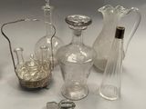 a lot of glass items that are sitting on a table