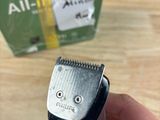 a person holding an electric shaver in their hand