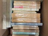 a box full of books sitting on a table
