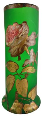 green vase with gold leaf and flower design on it