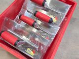 a red box with four different tools inside of it
