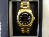 a watch that is in a box on the table