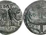 une pièce d'argent sur laquelle figurent une femme et un homme