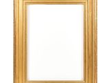 a gold frame on a white wall with a white background