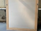 a picture of a picture frame sitting on the floor