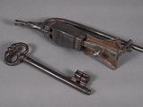 two old keys sitting next to each other on a table