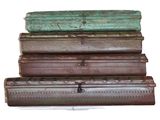 several pieces of luggage stacked on top of each other on a white surface
