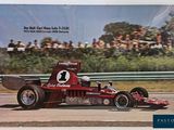 a picture of a race car driving on a track