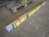 a large yellow beam sitting on the floor next to a pallet