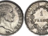 Gros plan sur une pièce de monnaie portant le visage d'un homme