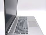 a close up of a laptop computer on a white surface