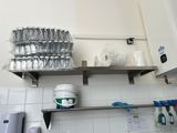 a shelf that has a lot of utensils on it
