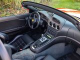 a car that is sitting in the driveway with its dashboard down