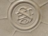 a close up of a white vase with a design on it