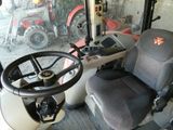 a tractor that is parked in a garage