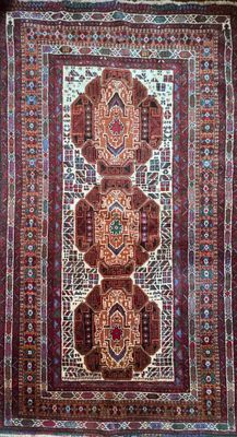 an oriental rug with four medallions on a red ground
