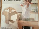 a box with a picture of a child sitting on a chair