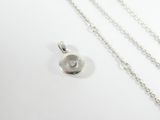 silver plated necklace with a single flower pendant on a chain