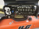 a close up of the engine of an orange tractor