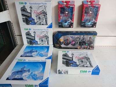 four boxes of legos sitting on a table