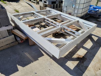 a picture of a metal frame being built in a yard