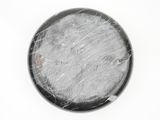 black and white picture of a round object on a white surface