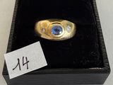 an image of a ring with a sapphire and diamonds in it