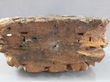 a piece of wood with holes in it on a table