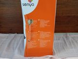 a box that is sitting on a bed with a remote in it