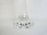 a clear glass candle holder on a white table